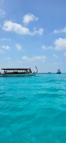 a pier in the middle of the ocean at Chambao Maldives in Guraidhoo