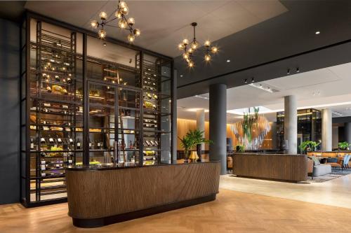 a wine tasting room with a wall of wine bottles at Johannesburg Marriott Hotel Melrose Arch in Johannesburg