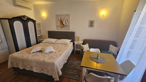 Posteľ alebo postele v izbe v ubytovaní Viktorija Apartments