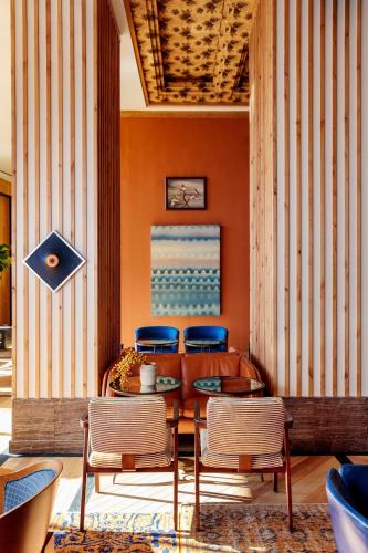a dining room with a table and two chairs at Austin Proper Hotel, a Member of Design Hotels in Austin