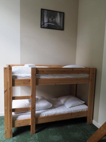 a couple of bunk beds in a room at Hostel Roots in Tilburg