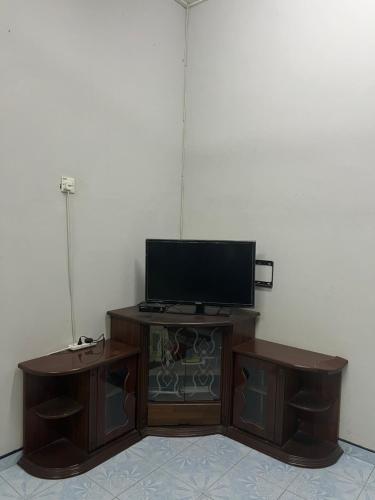 a flat screen tv sitting on top of a cabinet at HOMESTAY NO.45 in Jitra