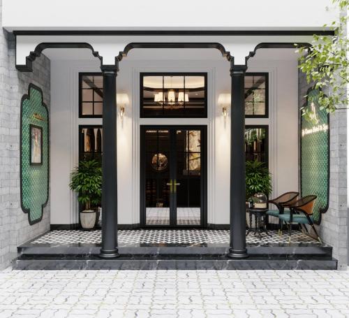 a front porch with black doors and a patio at Ja Cosmo Hotel and Spa in Hanoi