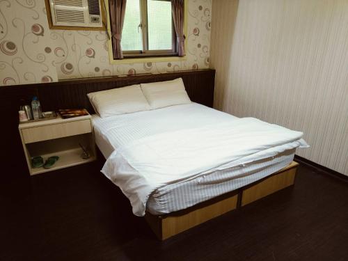 Katil atau katil-katil dalam bilik di Kaixiang Homestay