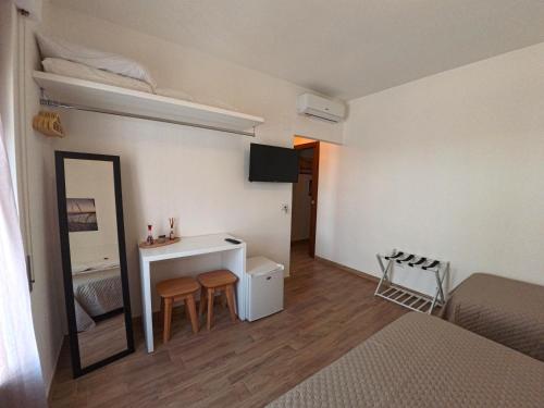 TV o dispositivi per l'intrattenimento presso Sunrise Bed and Breakfast