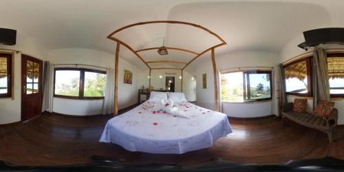 Ein Bett oder Betten in einem Zimmer der Unterkunft Pousada TERRA NOVA