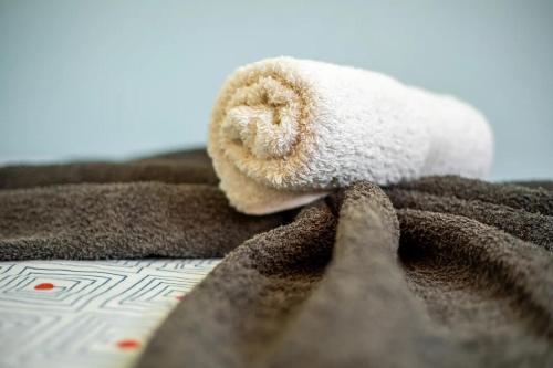 a stuffed animal laying on top of a blanket at Apartments near the beach, with terrace and WIFI in Costa Calma