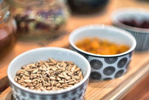 two bowls of food sitting on a table at Kyriad Prestige Mulhouse - Basel in Sausheim