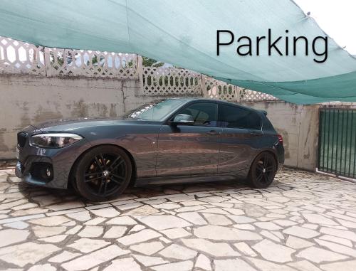 a car parked under a tent on a stone ground at Leos Villa in Tragjas