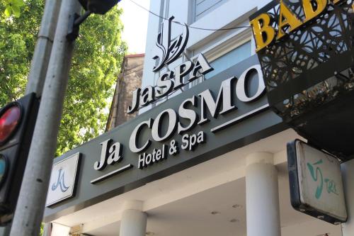 a sign for a japanese restaurant on a building at Ja Cosmo Hotel and Spa in Hanoi