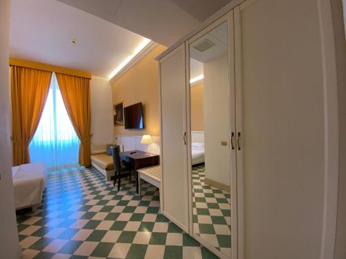 Basilica Hotelにあるベッド