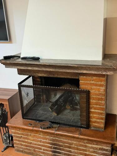a fireplace with a table on top of it at DolceVita Eur2 Luxury Apartament in Rome