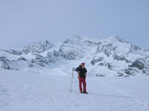a person is standing in the snow with a ski pole at CHALET A CERESOLE REALE nel Parco Gran Paradiso in Ceresole Reale