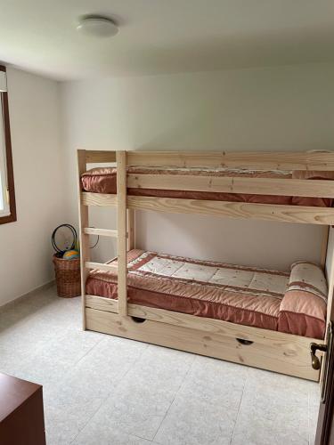 two wooden bunk beds in a room with at La Fincurri del Nando in A Coruña