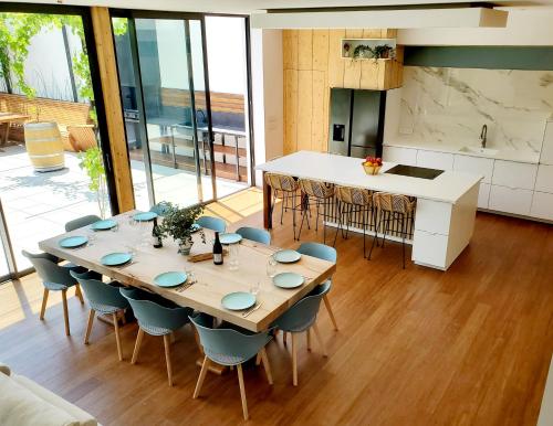 a kitchen and dining room with a table and chairs at Luxury Bali Villa in Hossegor 5 stars- Pool & Petanque in Hossegor
