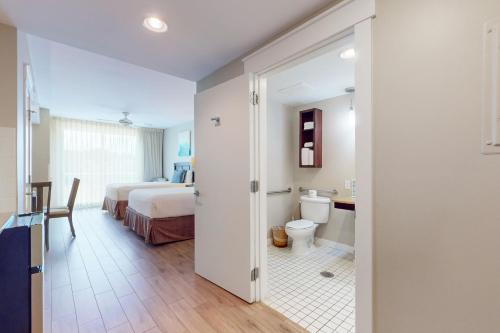 a bathroom with a bed and a toilet in a room at Elation #5216 in Destin