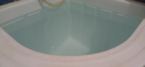 a white toilet seat with a ring in the middle at ELTARI Pine House in Kidal