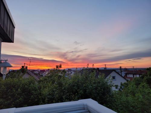 a view of a sunset from the balcony of a house at Alexa's Appartment - Nähe Europa Park in Endingen