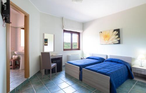 Postel nebo postele na pokoji v ubytování Villa Rossana