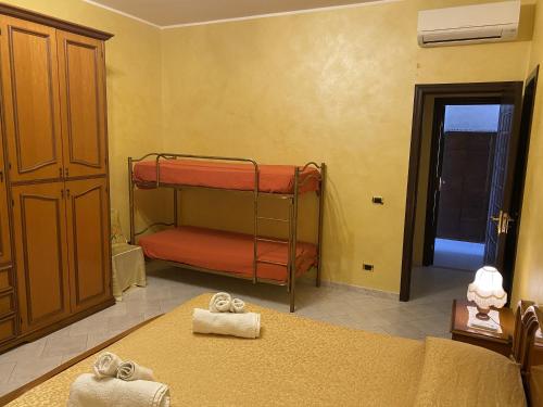 a bedroom with two bunk beds in a room at Villa Nino in Petacciato