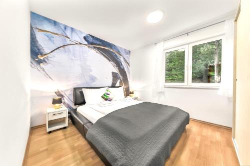 Ένα ή περισσότερα κρεβάτια σε δωμάτιο στο Apartmani Heta Alagic I