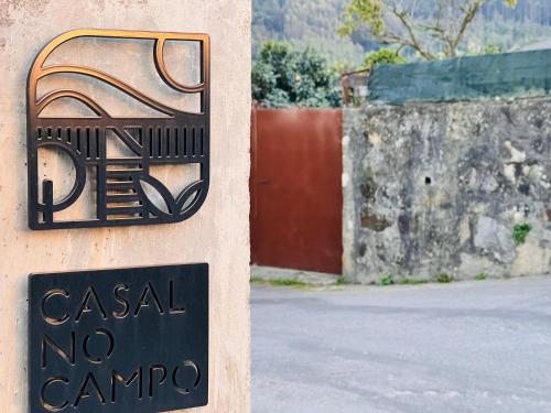 a sign on the side of a building with a no camino at Just Like Home - Casal no Campo in Vila Praia de Âncora