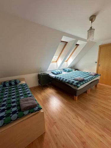 Postel nebo postele na pokoji v ubytování Apartmán Lípa Mikulov