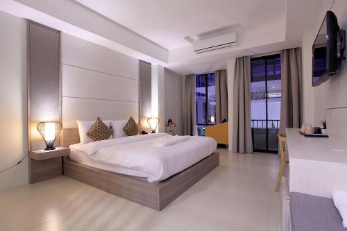 Säng eller sängar i ett rum på Win D Hotel