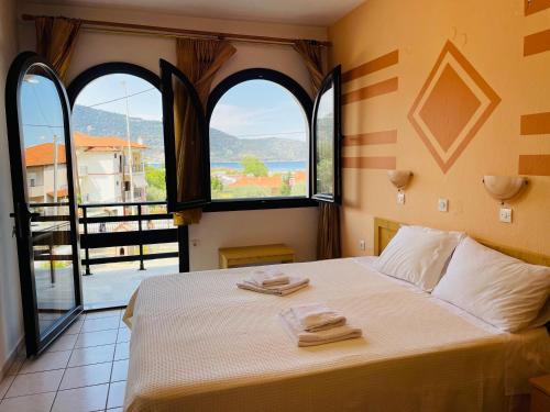 Ένα ή περισσότερα κρεβάτια σε δωμάτιο στο Villa Memories