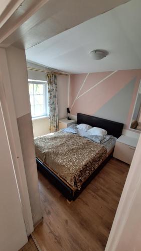 a bedroom with a bed in a room at Apartments Londa in Jūrmala