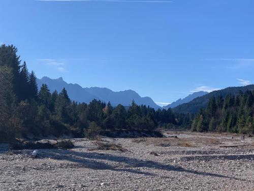 a view of a river with mountains in the background at Ferienwohnung Alpina 1 in Wallgau