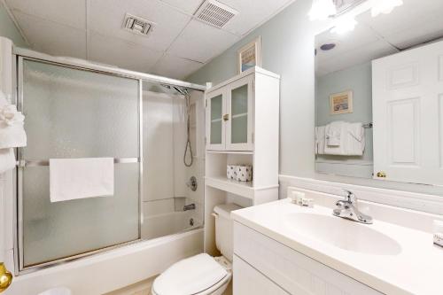 a bathroom with a shower and a sink and a toilet at Royal Garden Resort #1514 in Myrtle Beach