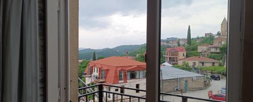 a view of a city from a window at Guest House Alazani Valley in Sighnaghi