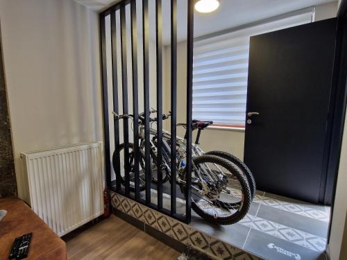 a bike in a bike rack in a room at Gîte Genius Loci in Marche-en-Famenne