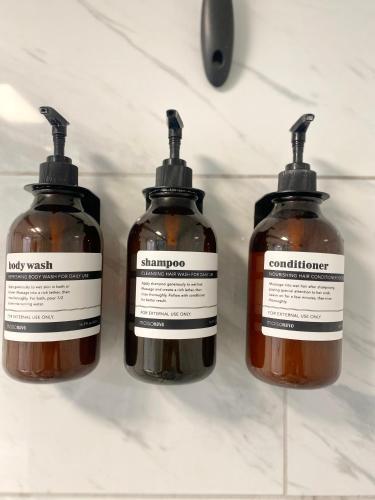 three bottles of honey sitting on a counter at Entire Guest Suite Pocatello in Pocatello