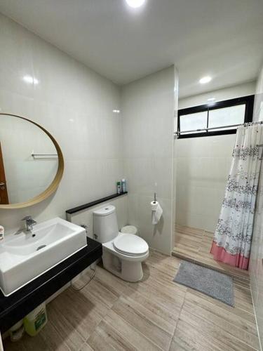 a bathroom with a sink and a toilet and a shower at Mountain hills house poolvilla saraburi muaklek in Ban Sap Phrik
