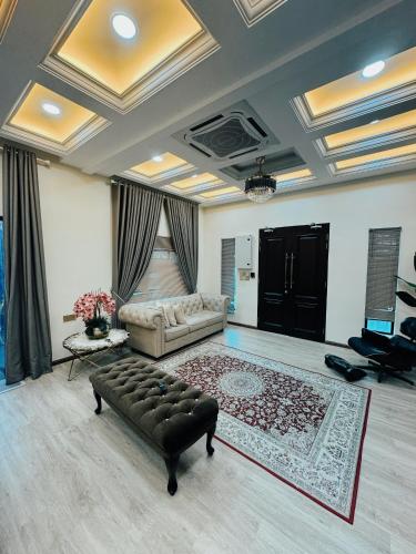 a living room with a couch and a table at Rumah Tuma in Shah Alam