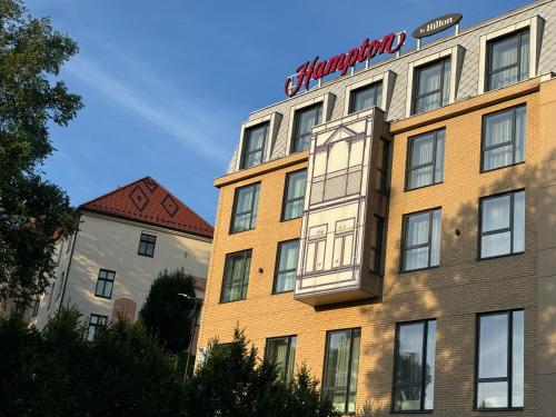 a building with a sign on the side of it at Penthouse21 in Oświęcim