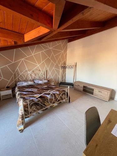 a bedroom with a bed and a wooden ceiling at Vesux Apartments in Naples