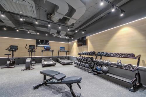 a gym with several exercise equipment in a room at Noru Hotel Malta - Adults Only Hotel in St Julian's