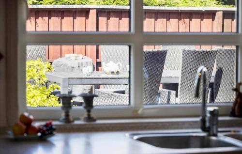 a kitchen counter with a sink and a window at Awesome Home In Hadsund With Wifi in Hadsund