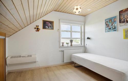 a white bedroom with a soccer ball on the ceiling at Awesome Home In Hadsund With Wifi in Hadsund