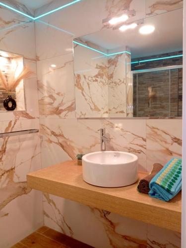 a bathroom with a sink and a mirror at Estudios 71 Sardinero RH - Santander in Santander