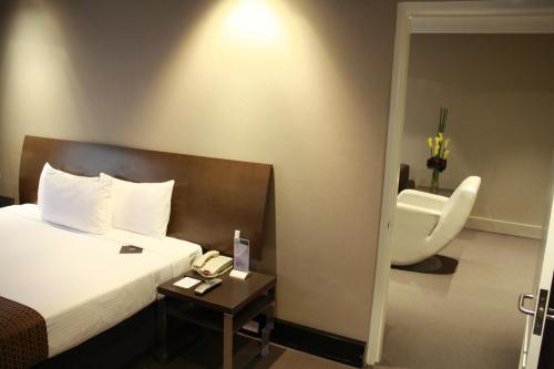 Ein Bett oder Betten in einem Zimmer der Unterkunft Pavilion On Northbourne