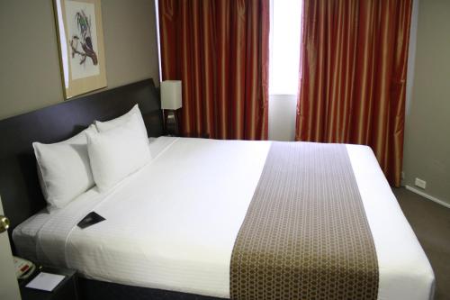 Ein Bett oder Betten in einem Zimmer der Unterkunft Pavilion On Northbourne