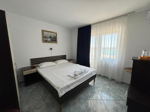 Postel nebo postele na pokoji v ubytování Complex Turistic Perla