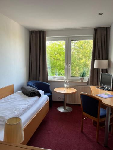 Postel nebo postele na pokoji v ubytování Kirchspielkrug Landhotel & Restaurant