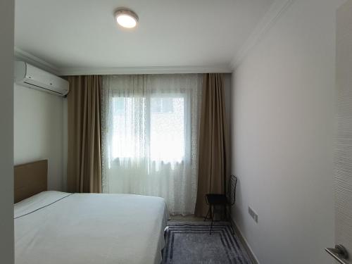 Ένα ή περισσότερα κρεβάτια σε δωμάτιο στο Mini home