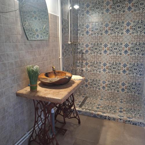 a bathroom with a sink and a shower at CAMPING THOBIAS in Boşorod