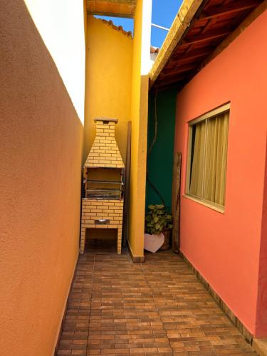 an empty hallway of a house with a building at Casa Da Cléo Carrancas in Carrancas